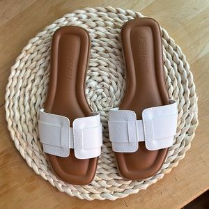 White flat sandals